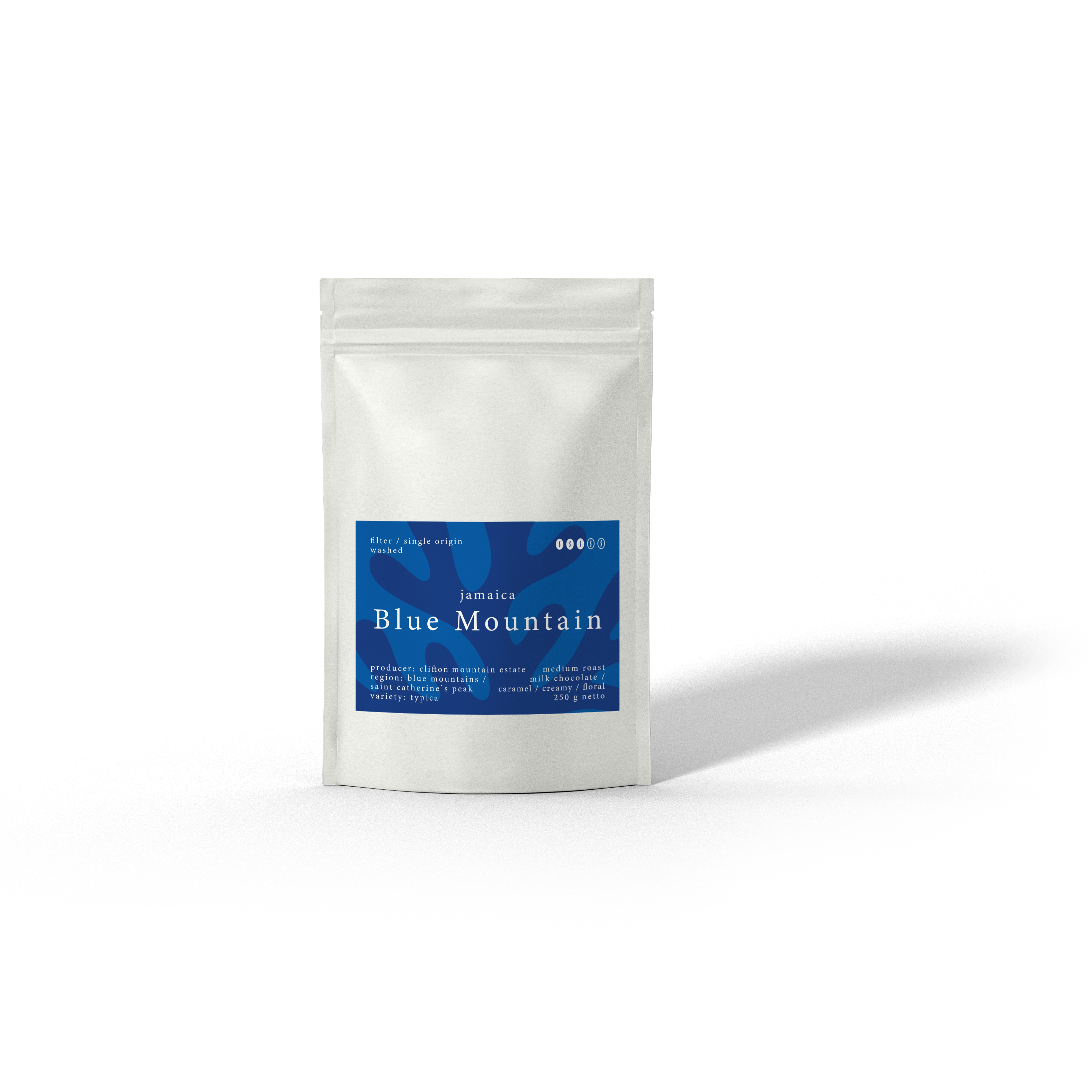 El Coral - Jamaica Blue Mountain, Spezialitätenkaffee der Caligo Kaffeerösterei Ahrensburg in weißer Tüte
